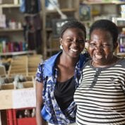 Two smiling women in grocery store in Uganda