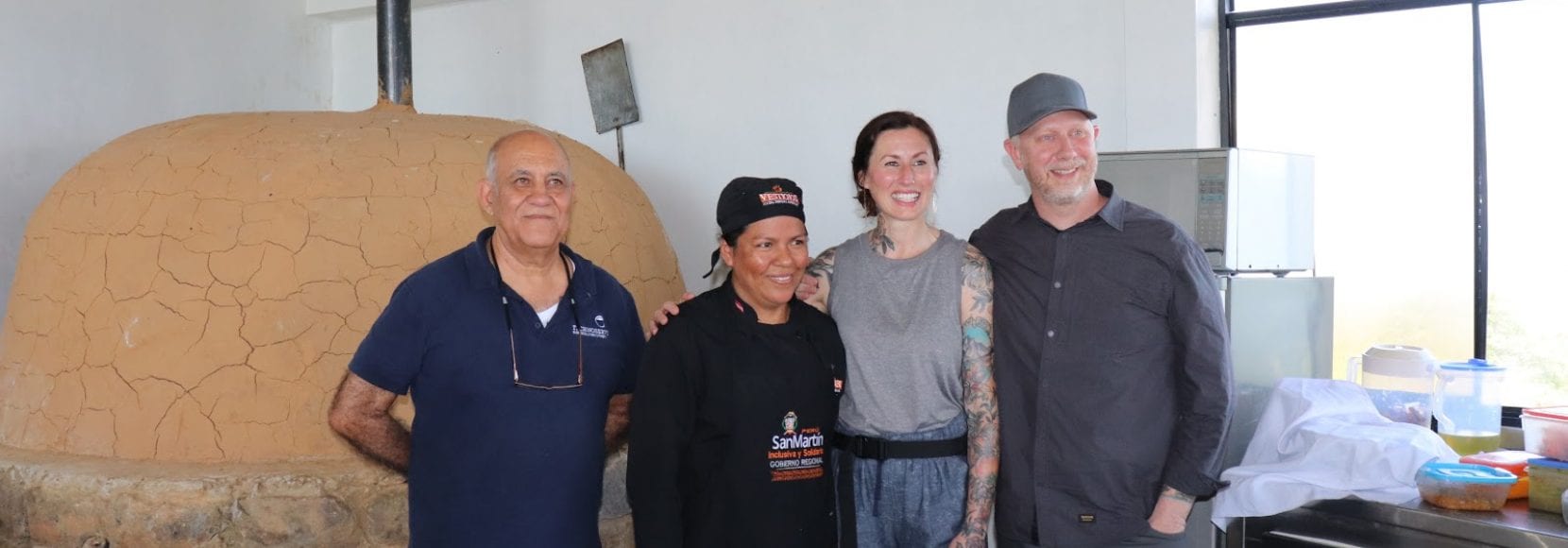 Group of smiling people posing for photo