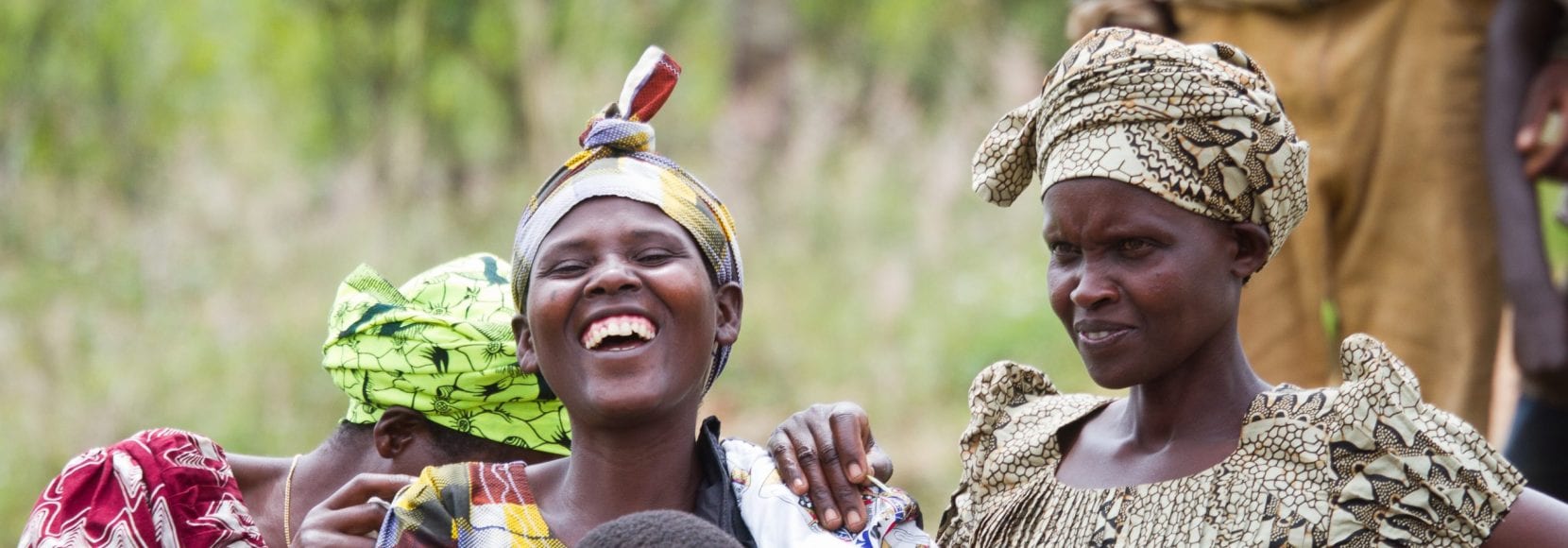Group of women and small children laughing