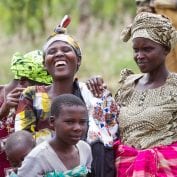 Group of women and small children laughing