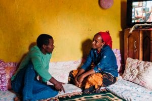 Lubaba and her son in their home