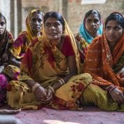 Women vegetable farmers have a discussion during a producer group meeting in Machahi village, Muzaffarpur, Bihar, India.