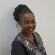 Smiling portrait of Nigerian country director