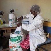 Women working on processing and bagging food