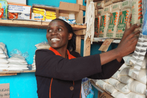 Micro-retail in Africa - woman shop keeper organizing store inventory