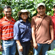 Coffee farmers and a TechnoServe trainer in Honduras