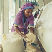 A woman worker at a grain mill in Sannie, Ethiopia