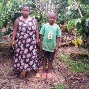 As Coffee farmers face the COVID-19 Crisis worldwide, Biringwa is no exception. Featured here, she stands with her son on their farm in Uganda