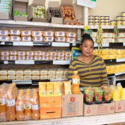 Jacinta Musyoka stands in her micro-retail shop in Nairobi, Kenya