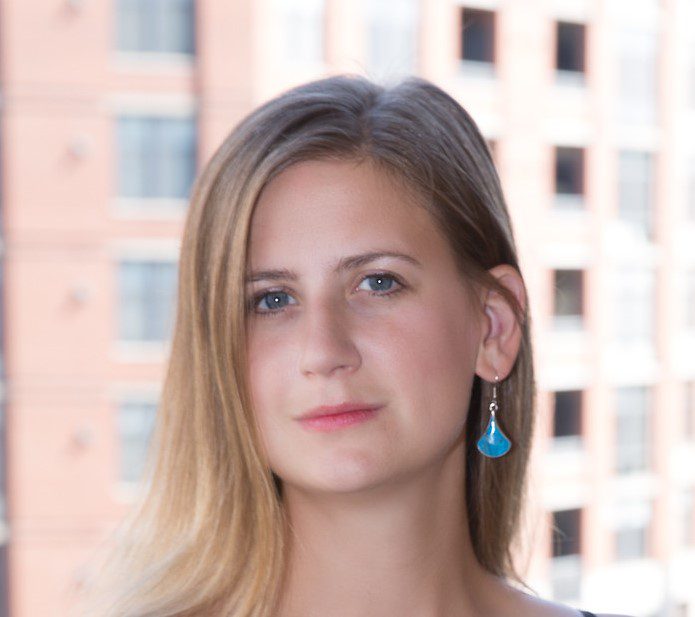 Headshot of Cait Nordhen, a gender specialist with nearly 10 years of experience promoting gender equality around the world. 
