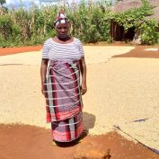 Jacinta Fernando is one of many farmers in northern Mozambique dealing with multiple crises at once. In this photo, she stands in front of her soy harvest.