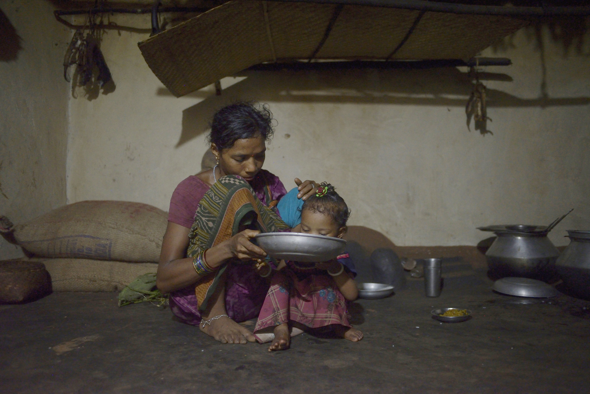 A woman feeds her daughter in the Rayagada district of Odisha, India. Photo Credit- Rohit Jain