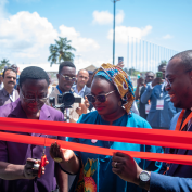 The ribbon cutting ceremony to launch Benin Cashew Week. From left to right: Alphonse Fandohan, representing the Minister of Agriculture; Maïmouna Mbacke, TechnoServe Bénin Country Director; and Ebo Sacramento, Deputy Chief of Staff for the Minister of Trade and Industry.