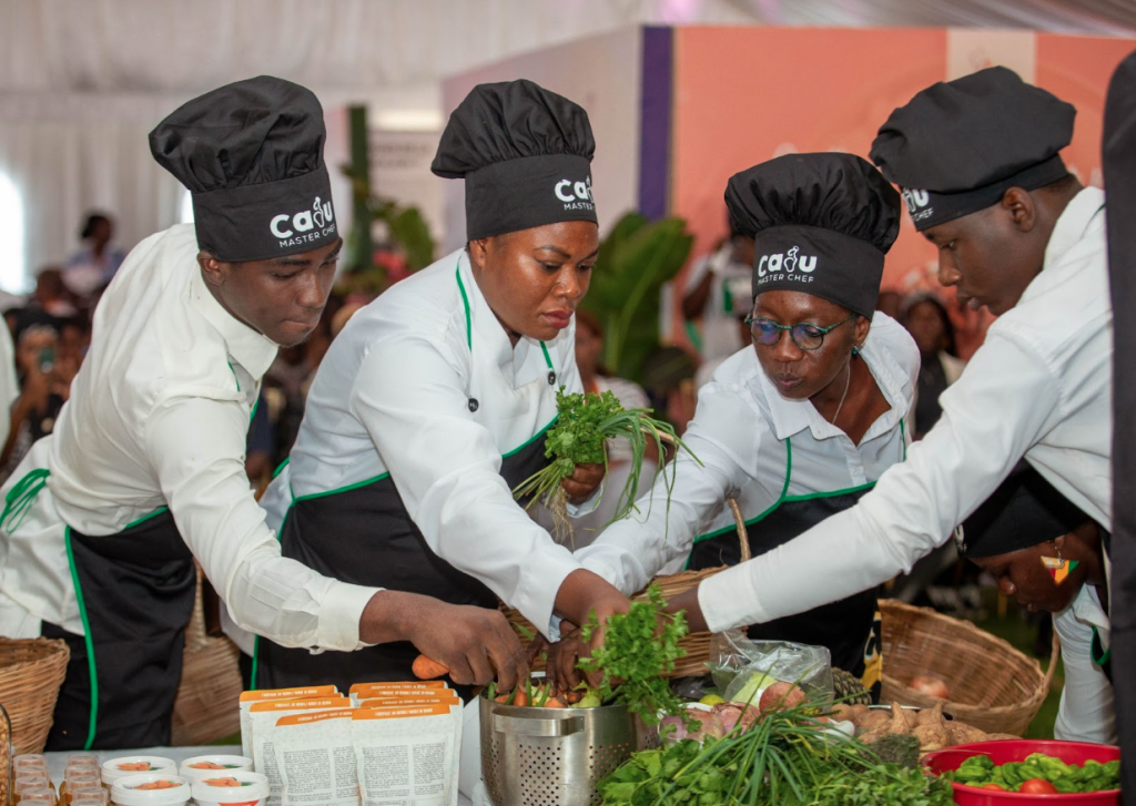 Cooking contestants select ingredients for their cashew-based dishes.