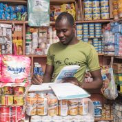 A shopkeeper in Abuja, Nigeria, participated in a TechnoServe program focused on developing entrepreneurial skills. Photo by James Kendi for TechnoServe. 