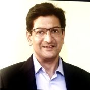 Country Director Joydeep Dutt smiling at the camera