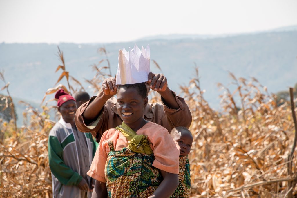 Judis Mkondga (center) participating in a farmer training as part of TechnoServe’s SAPPHIRE II maize project in Tanzania. The project reached nearly 30,000 smallholder maize farmers—50% of whom were women— in the Mbeya and Ruvuma regions with training on improved agronomic and post-harvest practices. Part of TechnoServe's photo of the month series. 