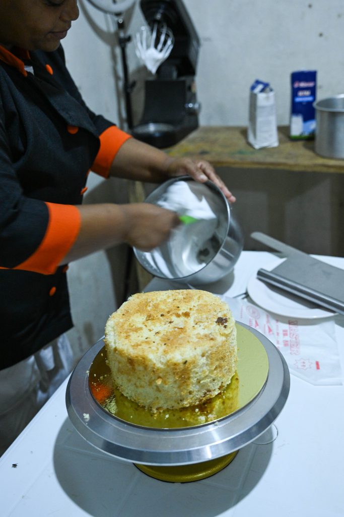 An image of an undecorated cake sitting on a table.