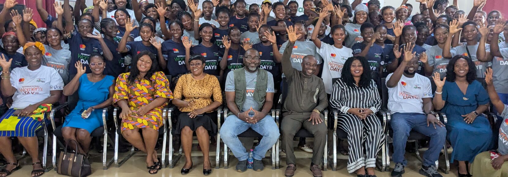 A large group of people gather at a TechnoServe event in Ghana geared toward women in agriculture.