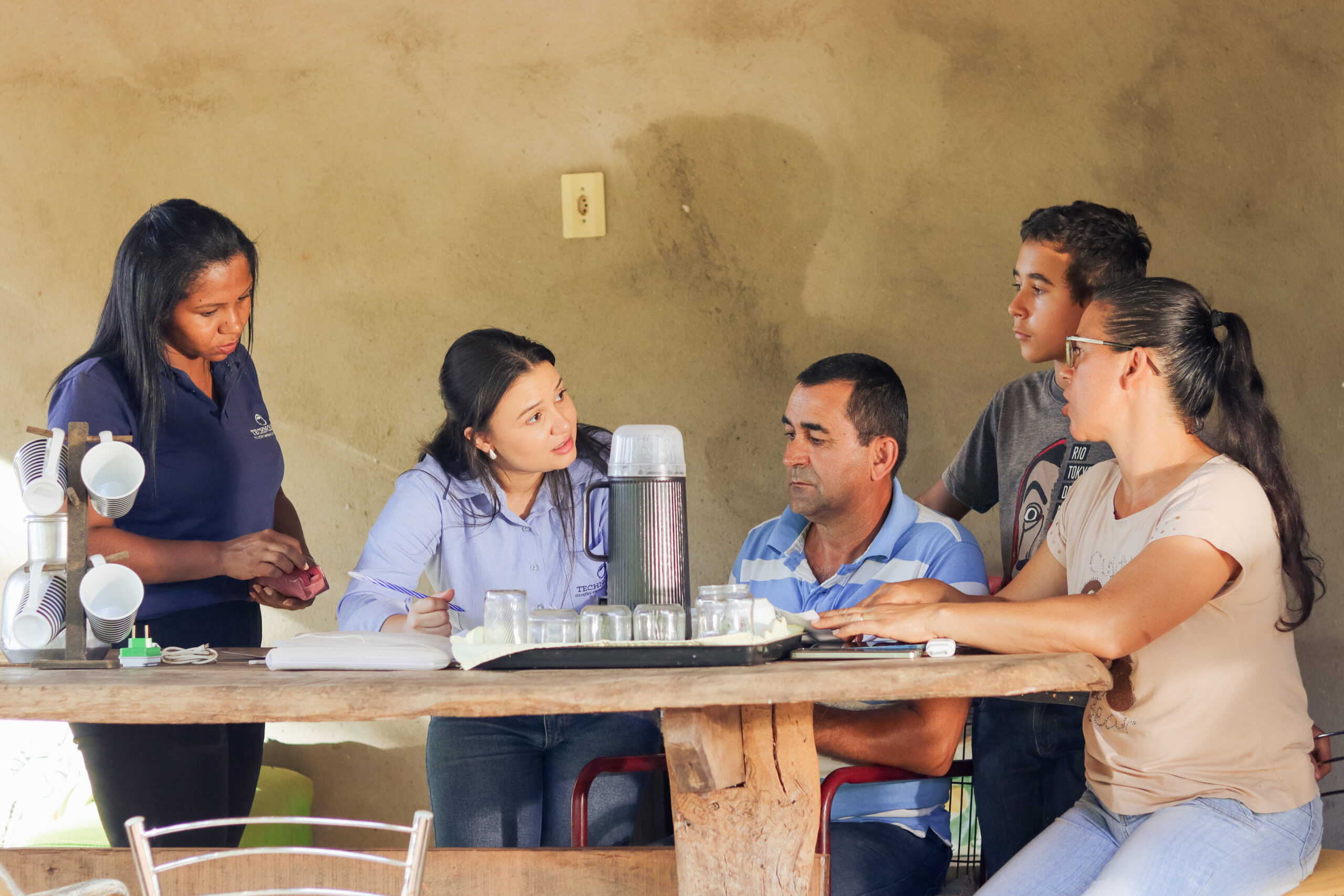 Jancarlo Silva (son), Suelene Silva (wife), and Valdimar Silva (husband) on their farm in Barro Alto, Brazil. Suelene and Vladimar are clients of the Crescer program funded by Anglo American. Photos by Khalila Lopes for TechnoServe. June 2025.