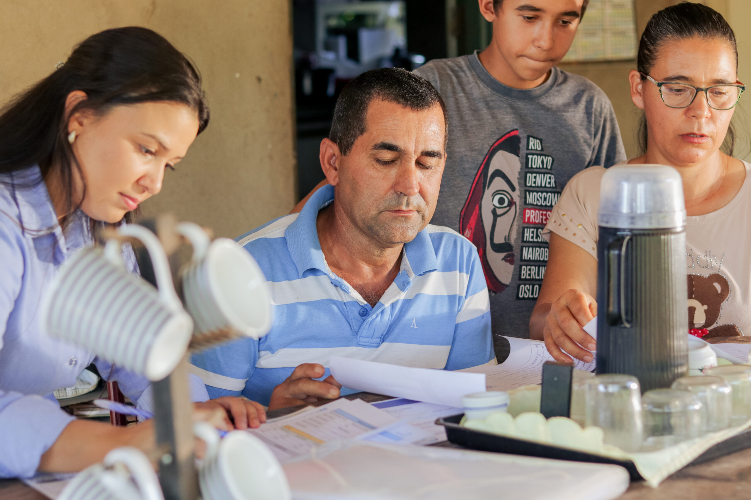 Jancarlo Silva (son), Suelene Silva (wife), and Valdimar Silva (husband) on their farm in Barro Alto, Brazil. Suelene and Vladimar are clients of the Crescer program funded by Anglo American. Photos by Khalila Lopes for TechnoServe. June 2025.
