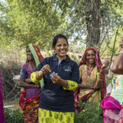 A TechnoServe trainer provides guidance to women farmers in India, enabling them to access better markets and achieve business solutions to poverty.