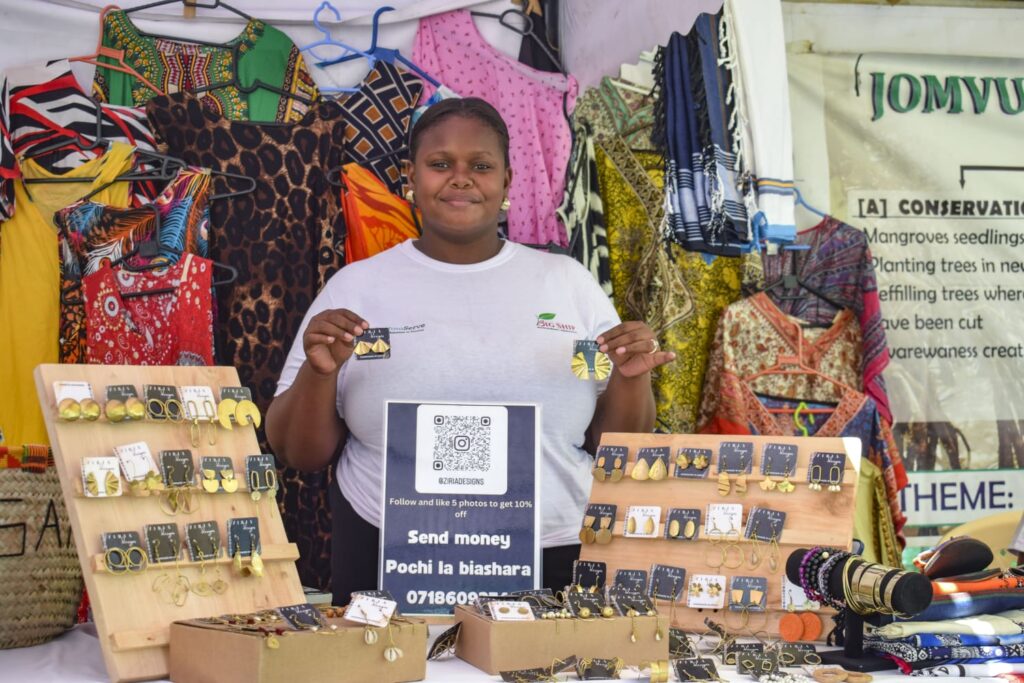 Gloria Mwadzi at an open-air market in Mombasa, marketing her products