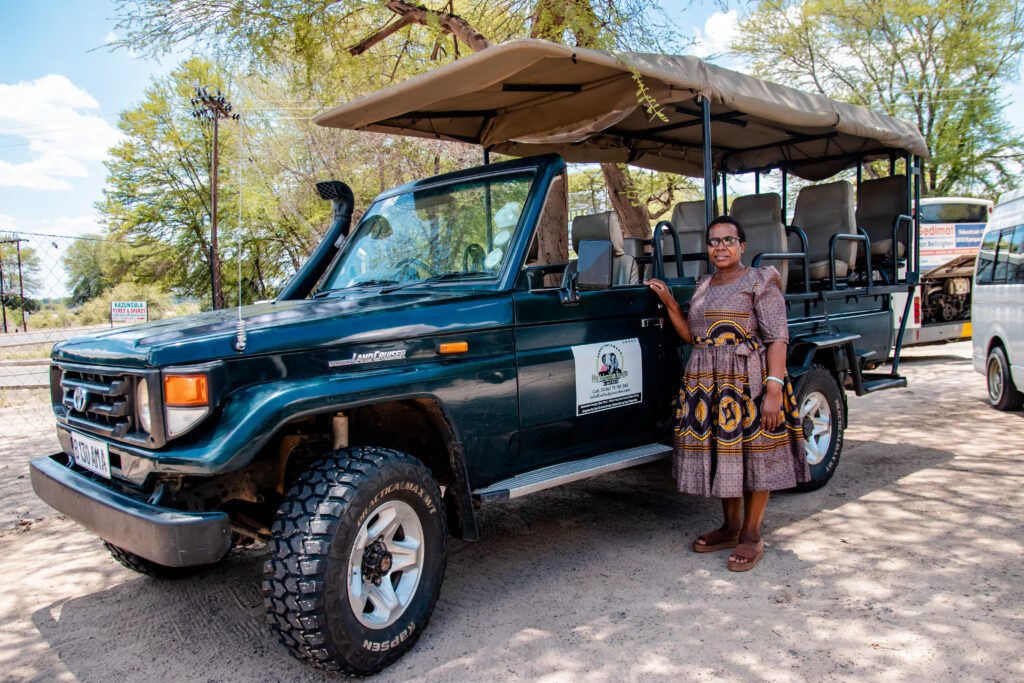 Joyce Chika in front of one of her safari vehicles in Botswana.