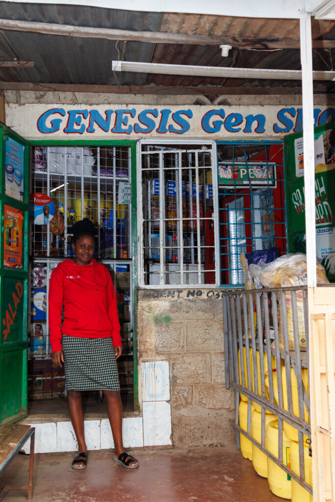 Nancy stands outside her shop in Nairobi, Kenya, in July 2026.&nbsp;